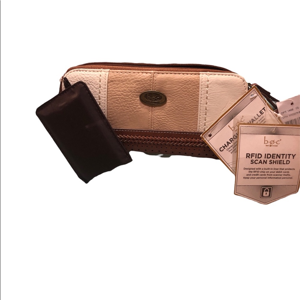 B.O.C Fanning wristlet with RFID Identity scan shield. Phone charger inside.